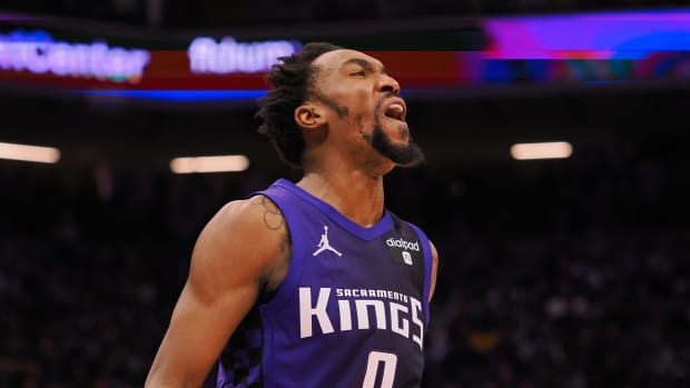 Feb 9, 2024; Sacramento, California, USA; Sacramento Kings guard Malik Monk (0) reacts after missing a shot against the Denver Nuggets during the fourth quarter at Golden 1 Center. Mandatory Credit: Kelley L Cox-USA TODAY Sports